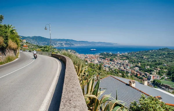 Road  to the city and a view of the Mediterranean coast of Italy.