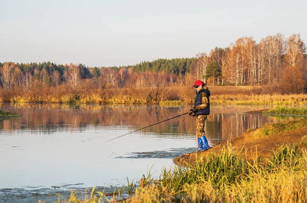 Fisherwoman with spinning rod — Stock Photo, Image