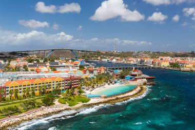 Willemstad in Curacao and the Queen Emma Bridge clipart