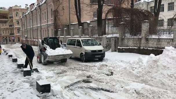 Snowplow truck removing snow near Maidan — Stock Video