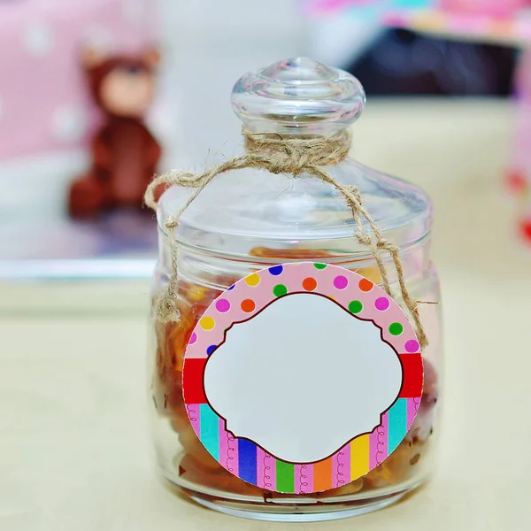 Sweet sugar candies in glass jars — Stock Photo, Image