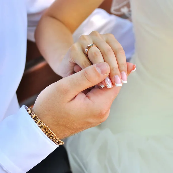 Bride and groom holding hands Stock Picture