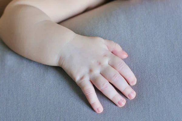 Tiny cute white baby hand — Stock Photo, Image