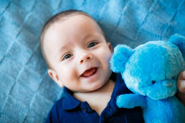 Portrait of  newborn boy is lying in the bed — Stock Photo, Image