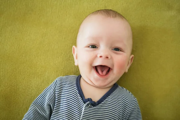 Portrait of  newborn boy is lying in the bed — Stock Photo, Image