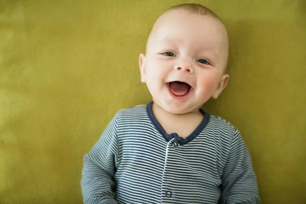 Portrait of  newborn boy is lying in the bed — Stock Photo, Image