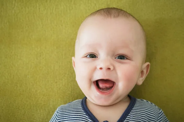 Portrait of  newborn boy is lying in the bed — Stock Photo, Image