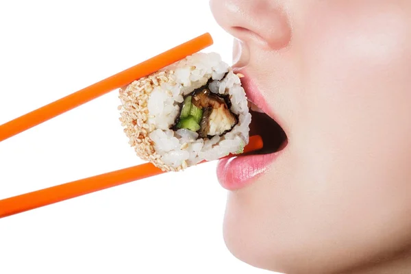 Beautiful girl holding sushi with a chopsticks, closeup — Stock Photo, Image