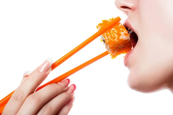 Beautiful girl holding sushi with a chopsticks, closeup — Stock Photo, Image