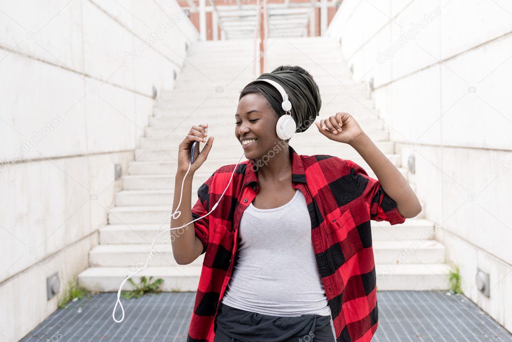 black woman listening music 