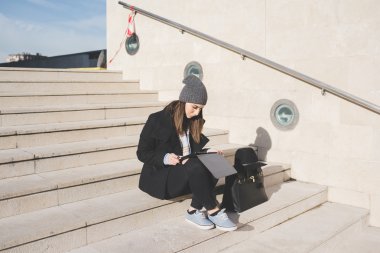 woman in the city using tablet 