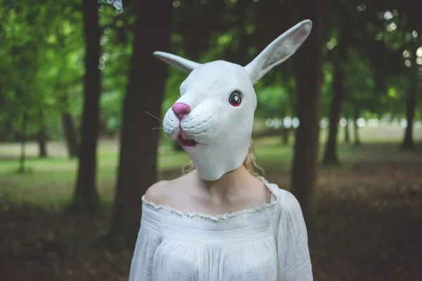 stock image woman wearing rabbit mask