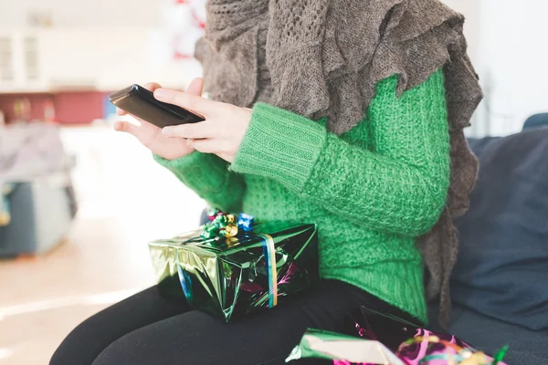 Woman tapping on screen of a smartphone — Stock Photo, Image