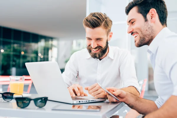 Business men sitting in a bar Stock Photo