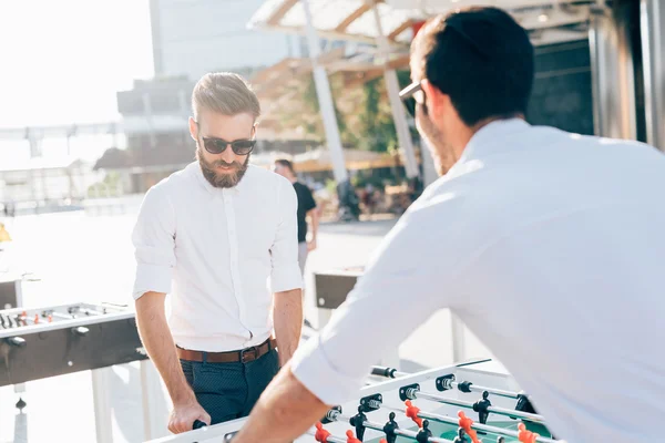 Businessmen playing table football — Stock Photo, Image