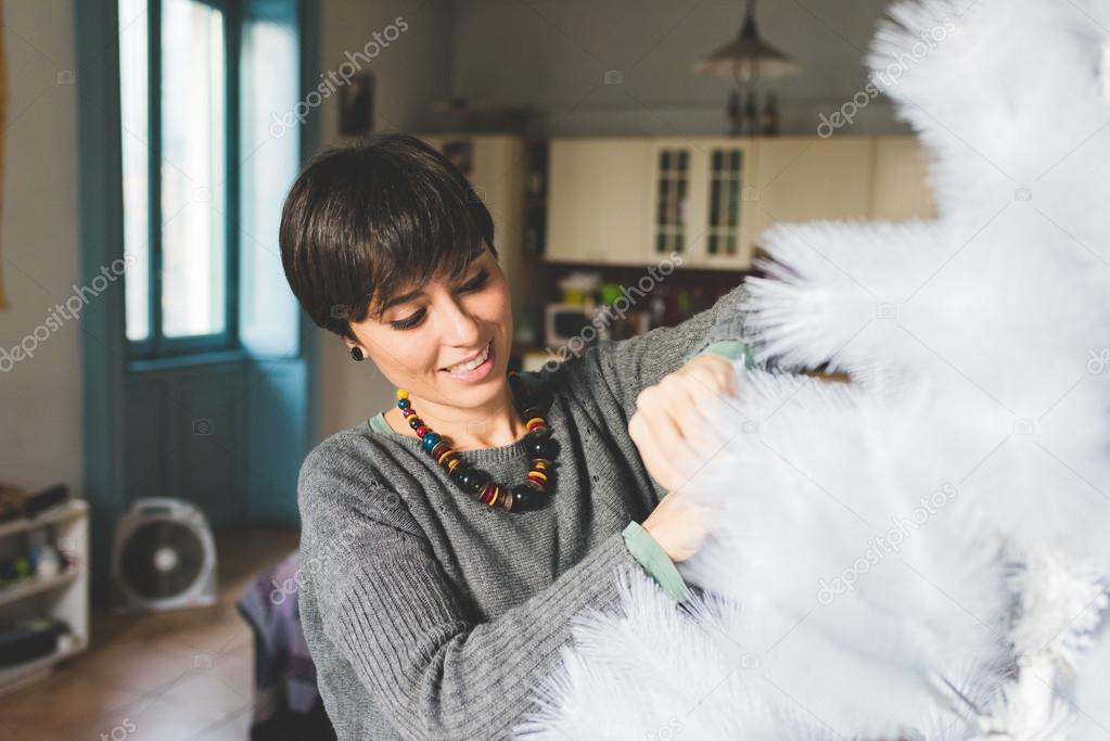 man and woman unpacking christmas tree