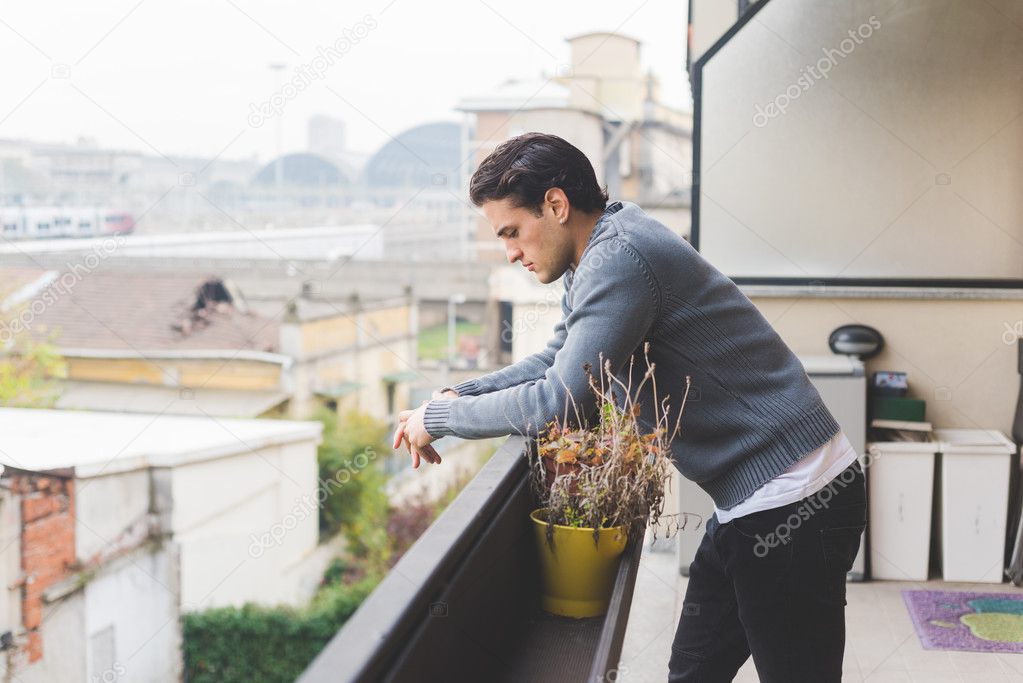 man standing on balcony outdoor