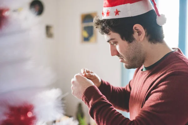 Man assembling christmas tree — Stock Photo, Image