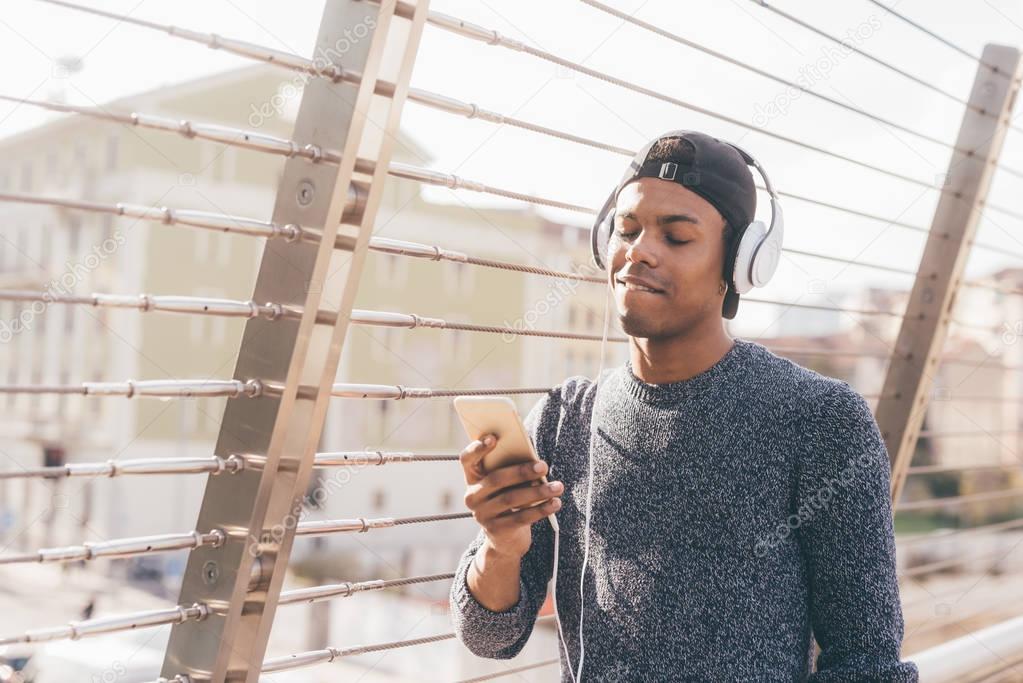 man listening music with headphones