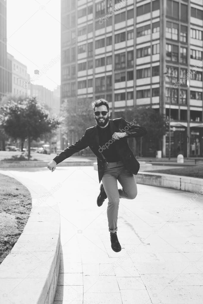 businessman jumping outdoor in city
