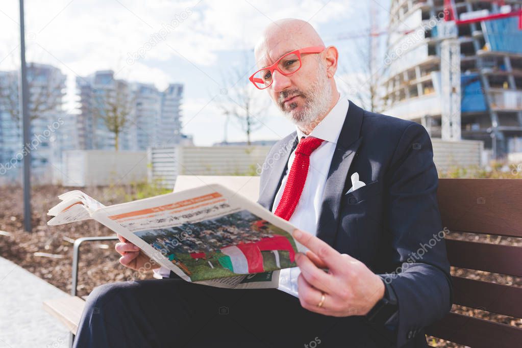 businessman reading newspaper 