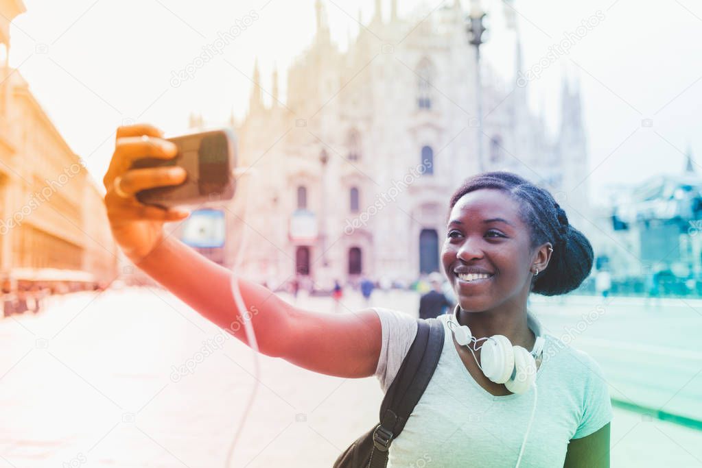 woman taking selfie with smartphone