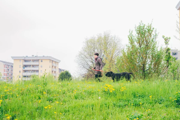 Woman walking with dog — Stock Photo, Image