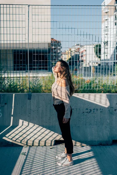 woman posing in city serious