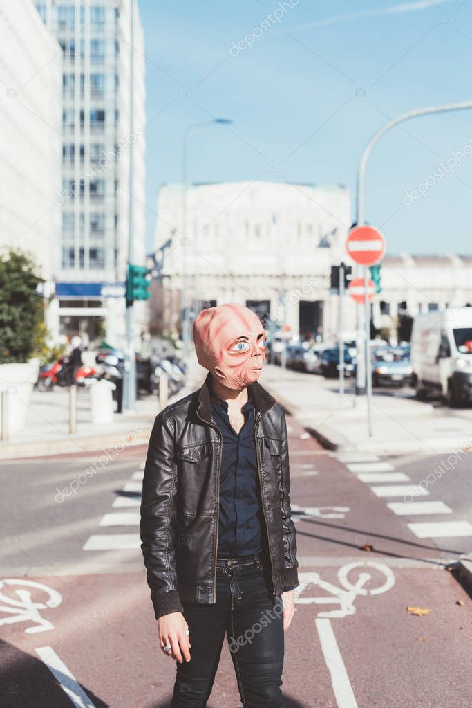 man wearing alien mask 