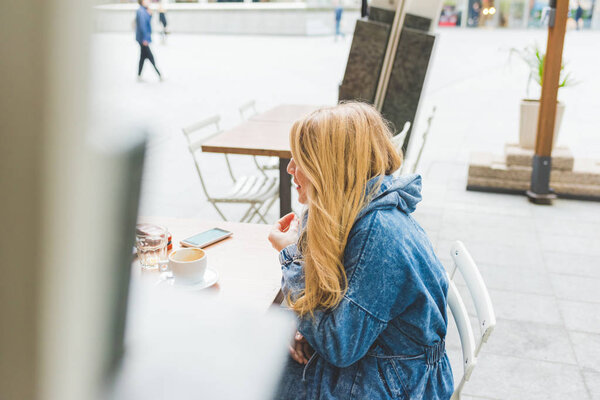 woman chatting with unidentifiable person