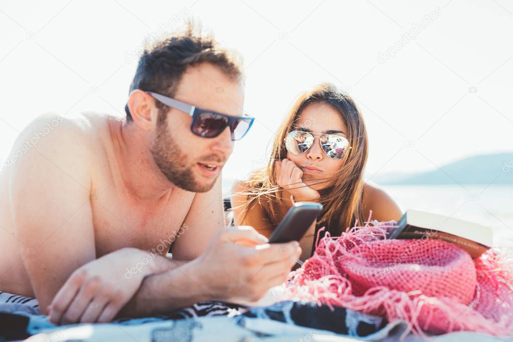 woman and man using smartphone 