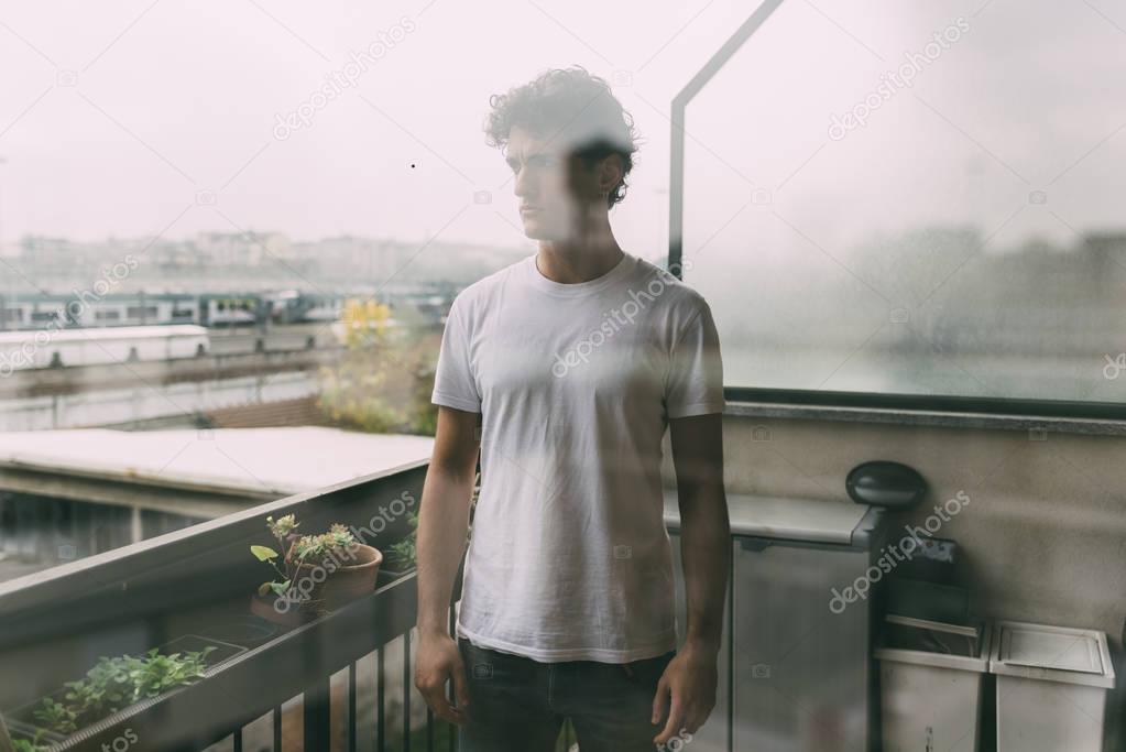 young man outdoor looking away