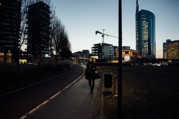 woman outdoor walking in city night