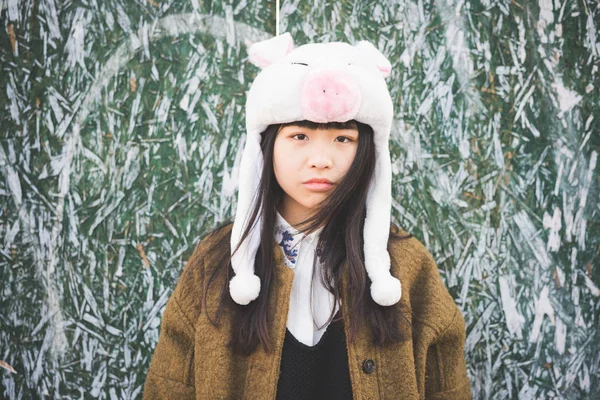 Woman wearing piggy hat — Stock Photo, Image