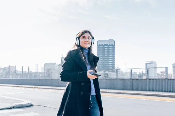 Young Woman Walking City Back Light Listening Music Headphones Smartphone — Stock Photo, Image