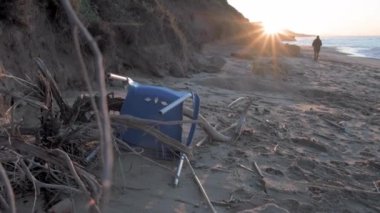 Slow motion garbage abandoned on seashore