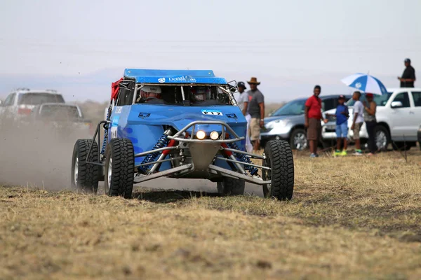 Speeding blue Zarco rally car front view — Stock Photo, Image