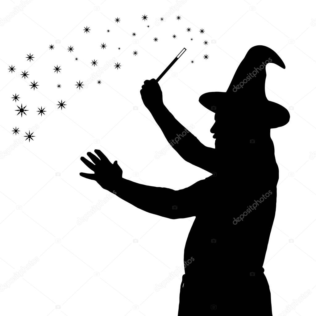 Silhouette of bearded wizard in cloak with pointed hat creating 