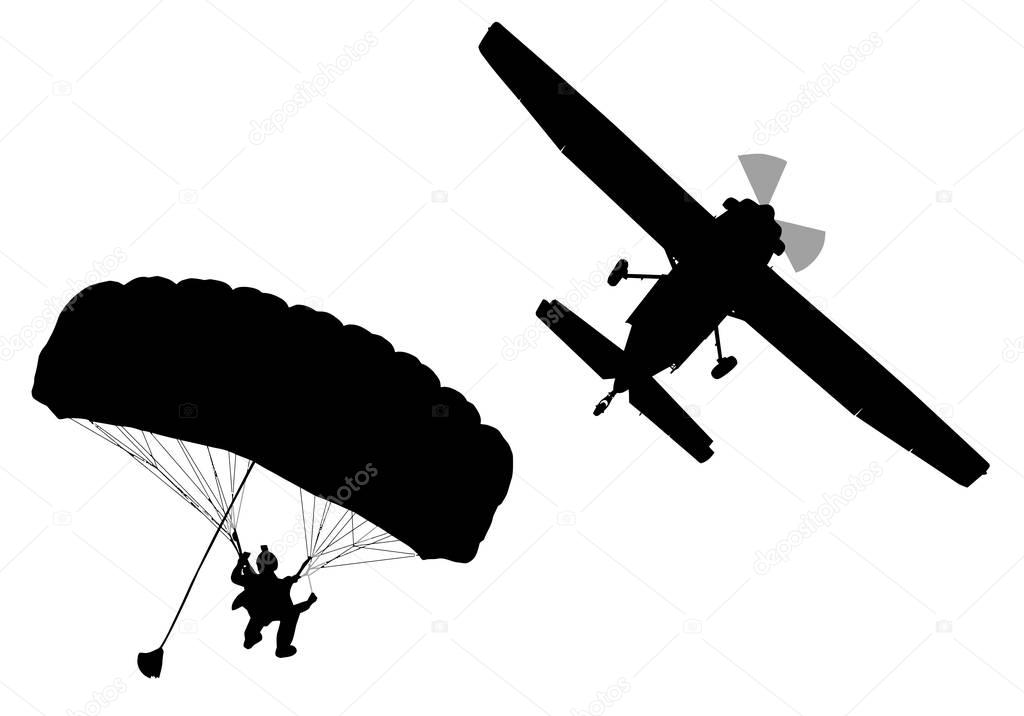 Bottom profile silhouette of sky diver with open parachute and a