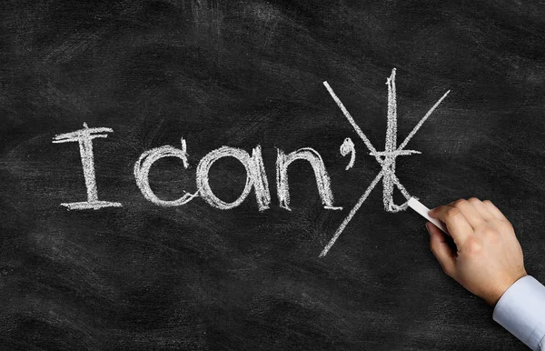 Hand writing with chalk on a blackboard — Stock Photo, Image