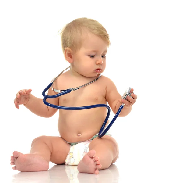 Infant child baby toddler sitting with medical stethoscope for p Stock Photo