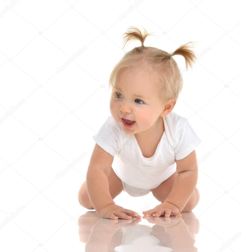 Infant child baby girl toddler crawling happy looking at the cor