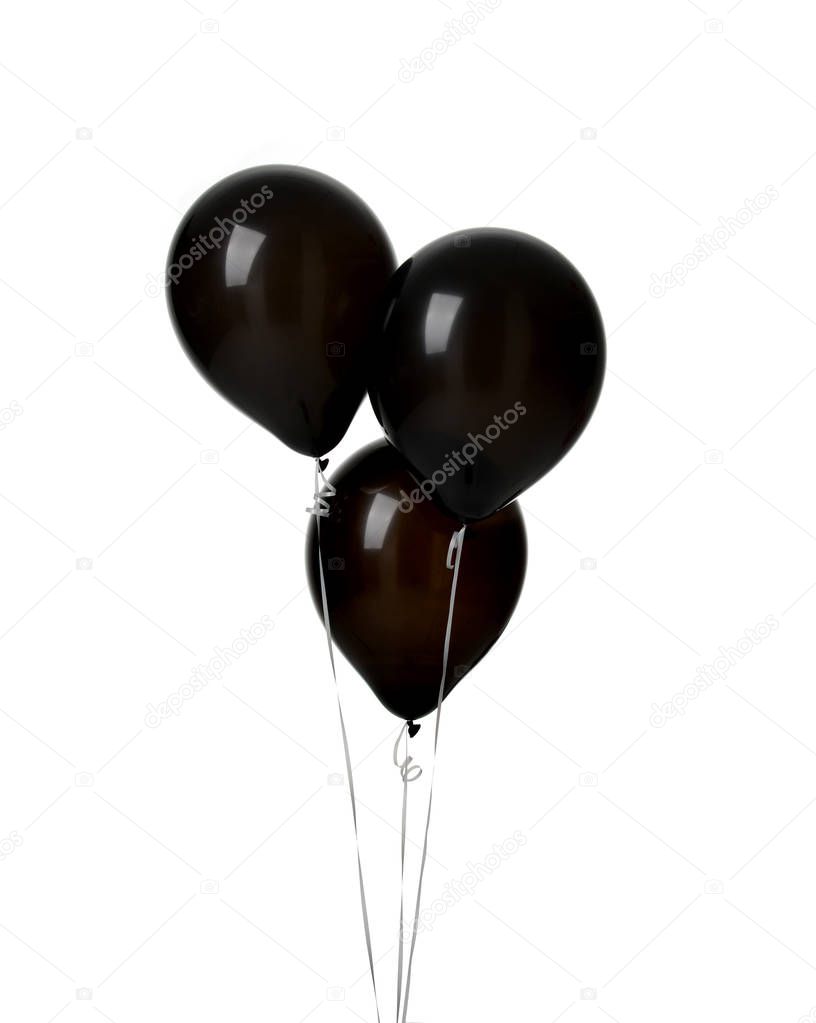 Bunch of three big black latex balloons for birthday party isolated on a white background