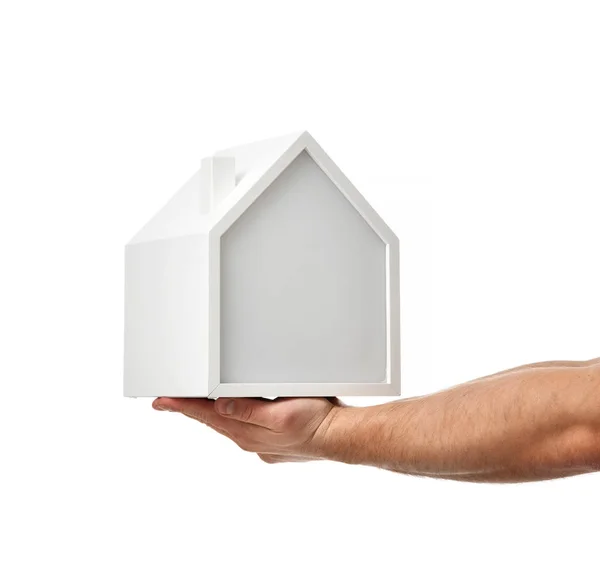 Men hands hold little house model isolated on white background. Property real estate Investment concept — Stock Photo, Image