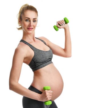 Hamile kadının spor germe yapması yeşil ağırlık egzersizleri. Hamilelik annelik beklentisi sağlıklı yaşam ve kilo kontrolü kavramı