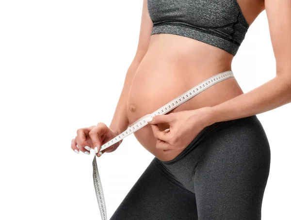 Pregnant woman measure big belly with tape measure — Stock Photo, Image
