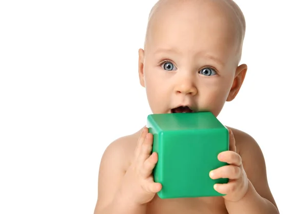 Infant child baby boy toddler sitting naked in diaper playing with green brick toy — Stock Photo, Image