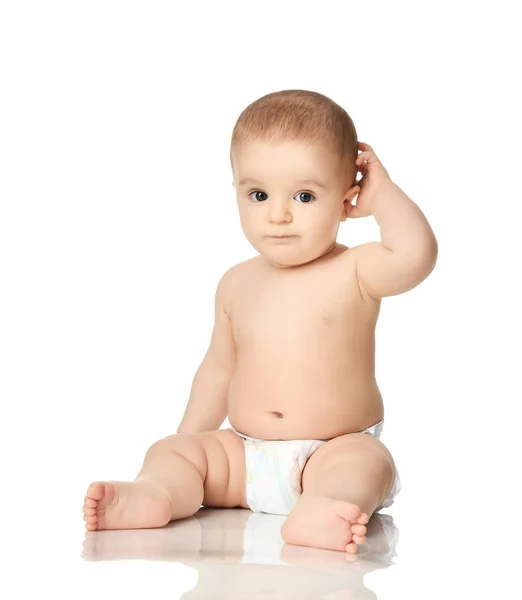 8 month infant child baby boy kid toddler sitting in diaper thinking scratch one head — Stock Photo, Image