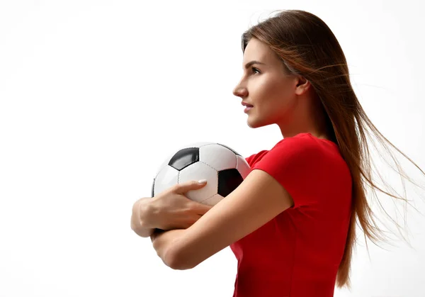 Fan sport woman player in red uniform hold soccer ball celebrating looking at the corner — Stock Photo, Image