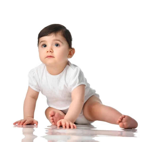 Ten month infant child baby  girl toddler crawling in white shirt looking up isolated — Stock Photo, Image